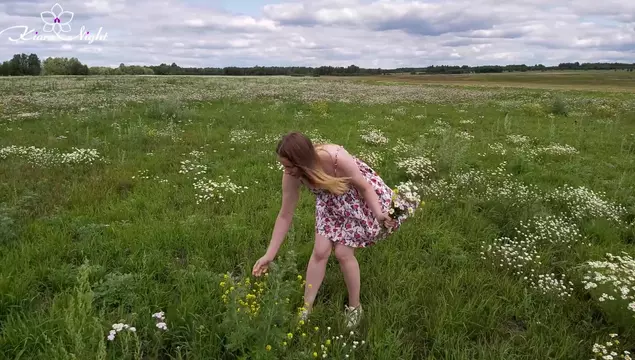 An excruciated blonde took off her underwear and jerked off a pussy in a chamomile field.